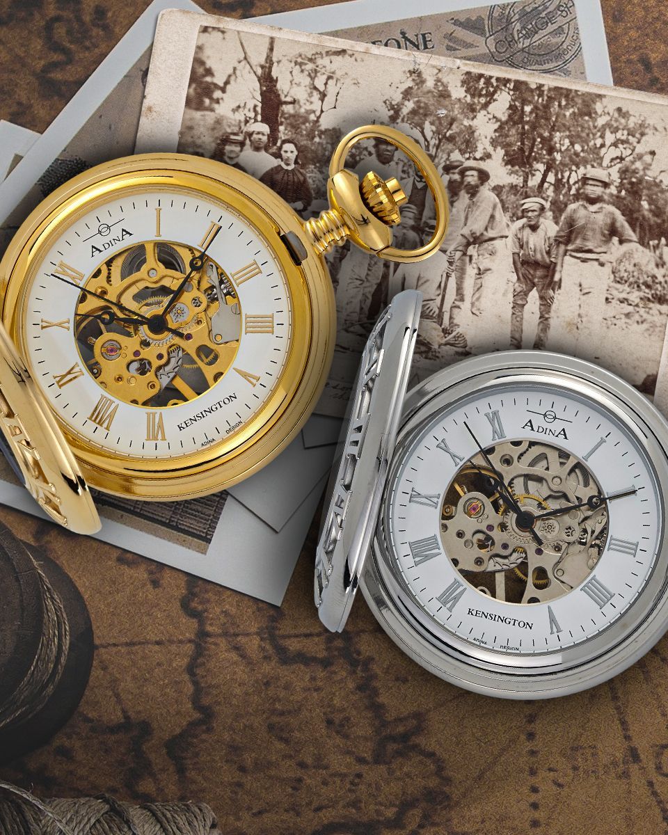 A gold and a silver pocket watch with skeleton dials rest on top of an old, sepia-toned group photograph and a map. — Coastal Clocks & Watches in Buddina, QLD