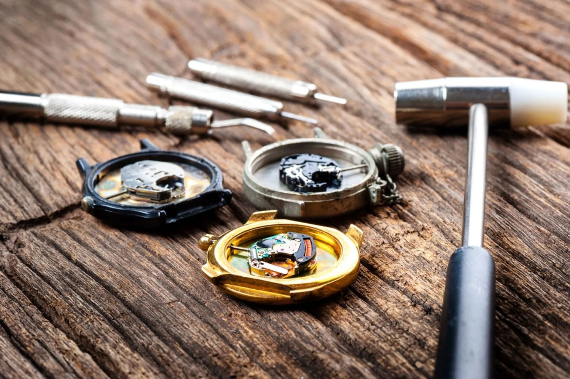 Watch Parts and Tools on Wood: Three Watch Faces Open With Tiny Mechanisms — Coastal Clocks & Watches in Buddina, QLD
