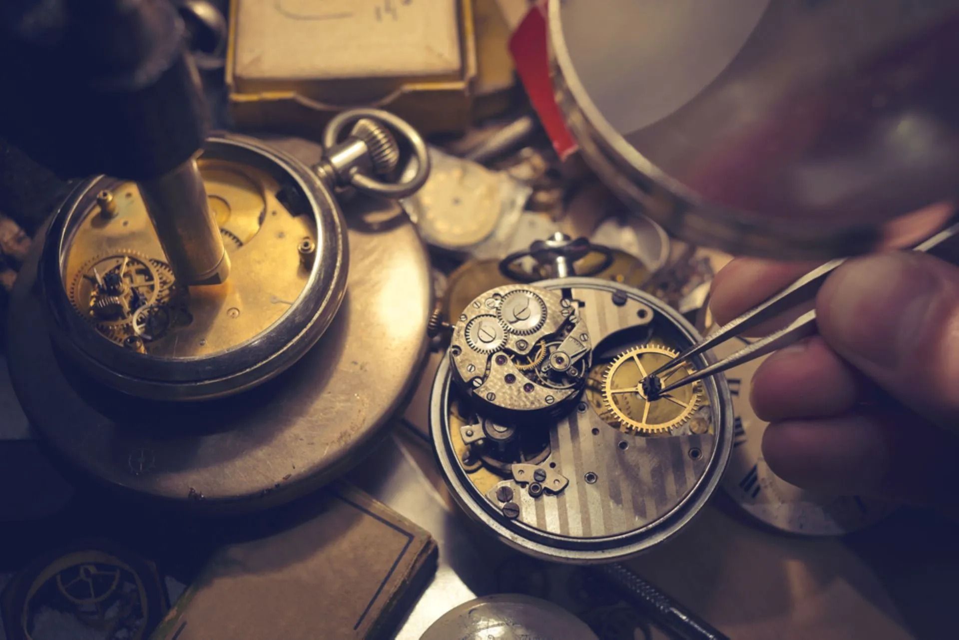 Watchmaker Working on Pocket Watch With Magnifying Glass and Tools — Coastal Clocks & Watches in Buddina, QLD
