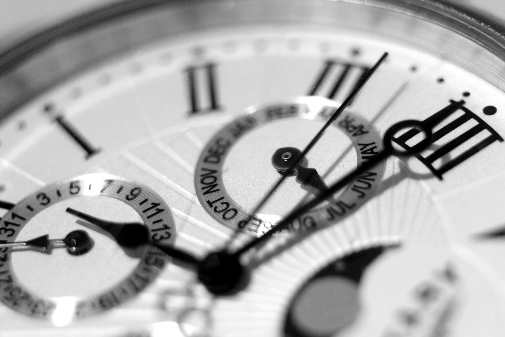 Silver Omega Seamaster watch with a light-colored dial and metal bracelet, sitting on a flat surface — Coastal Clocks & Watches in Buddina, QLD