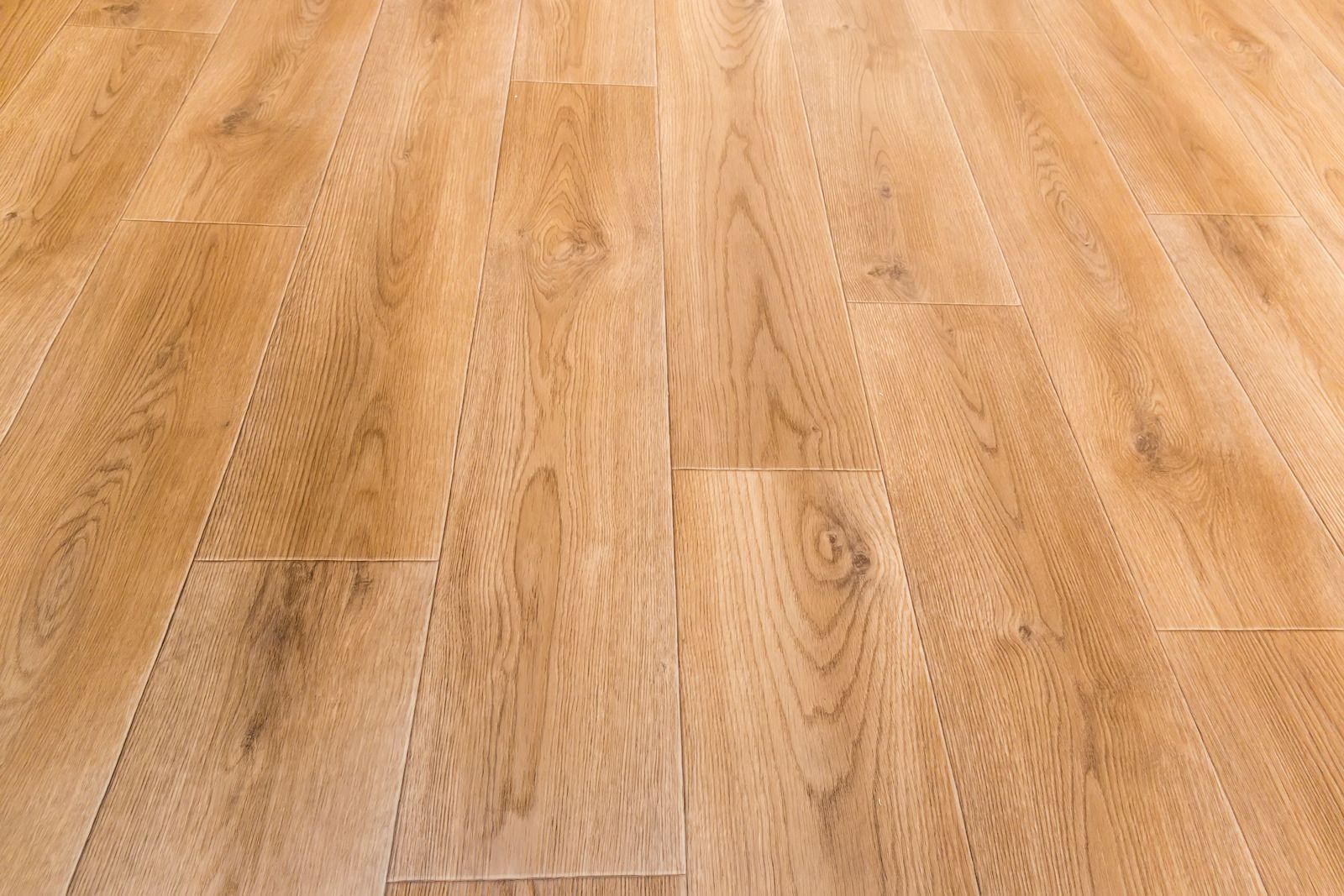 Light brown wooden floorboards with a natural grain pattern