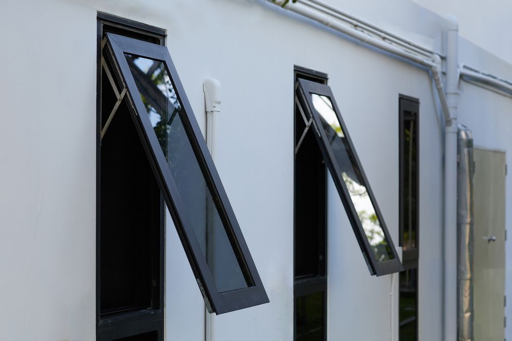Three Black-framed, Angled Windows on a White Building — Long Jetty Glass in The Entrance, NSW