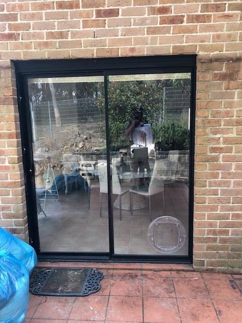Black-framed Sliding Glass Door Set in a Brick Wall — Long Jetty Glass in The Entrance, NSW