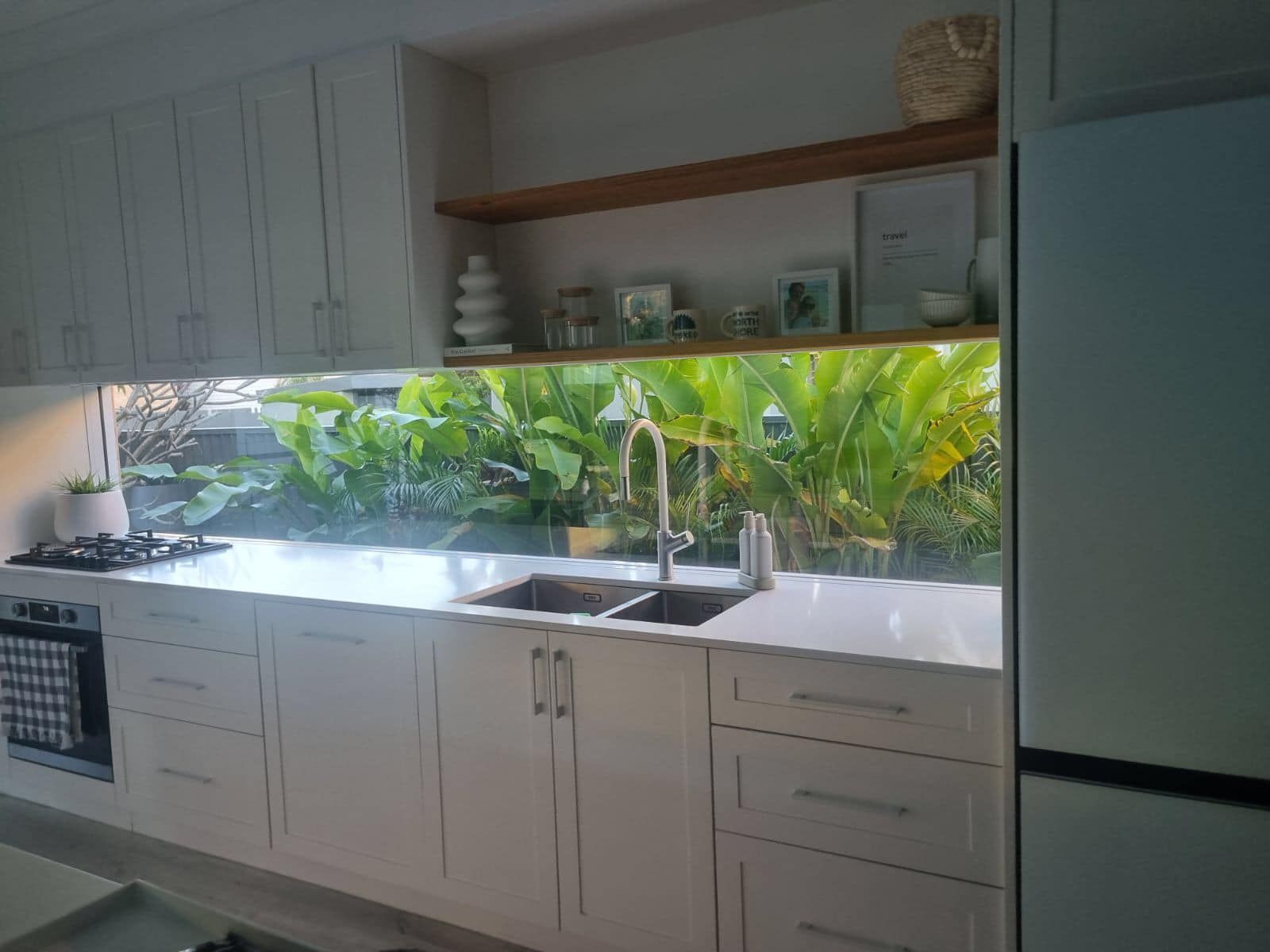 White Kitchen With a Large Window Overlooking Lush Greenery — Long Jetty Glass in The Entrance, NSW