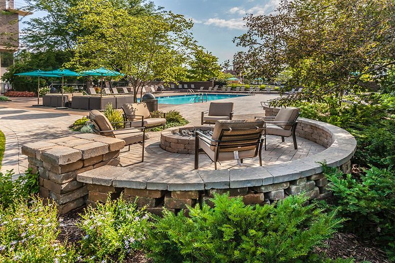 There is a fire pit in the middle of the patio.