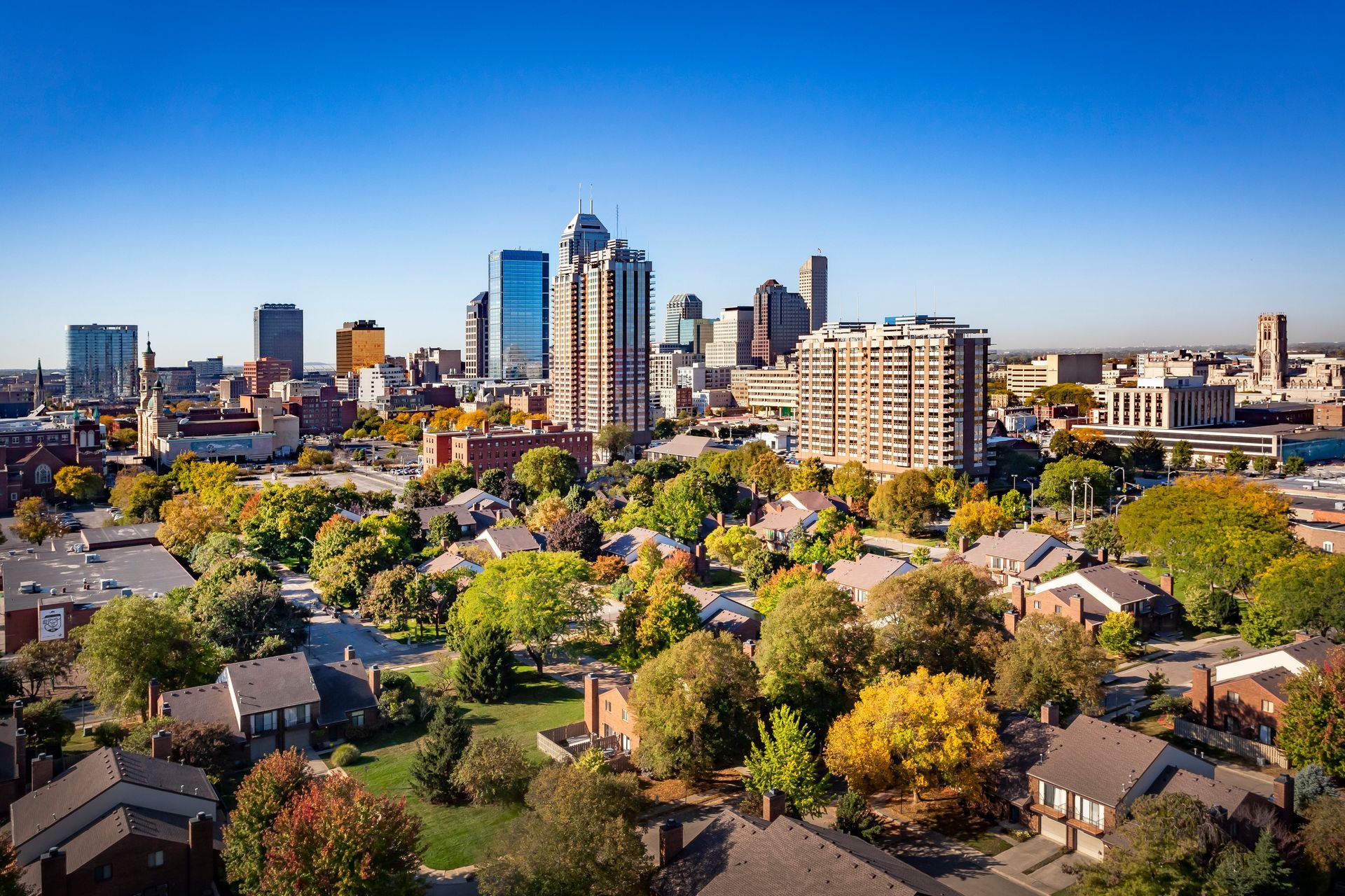 An aerial view of a city with a lot of buildings and trees.