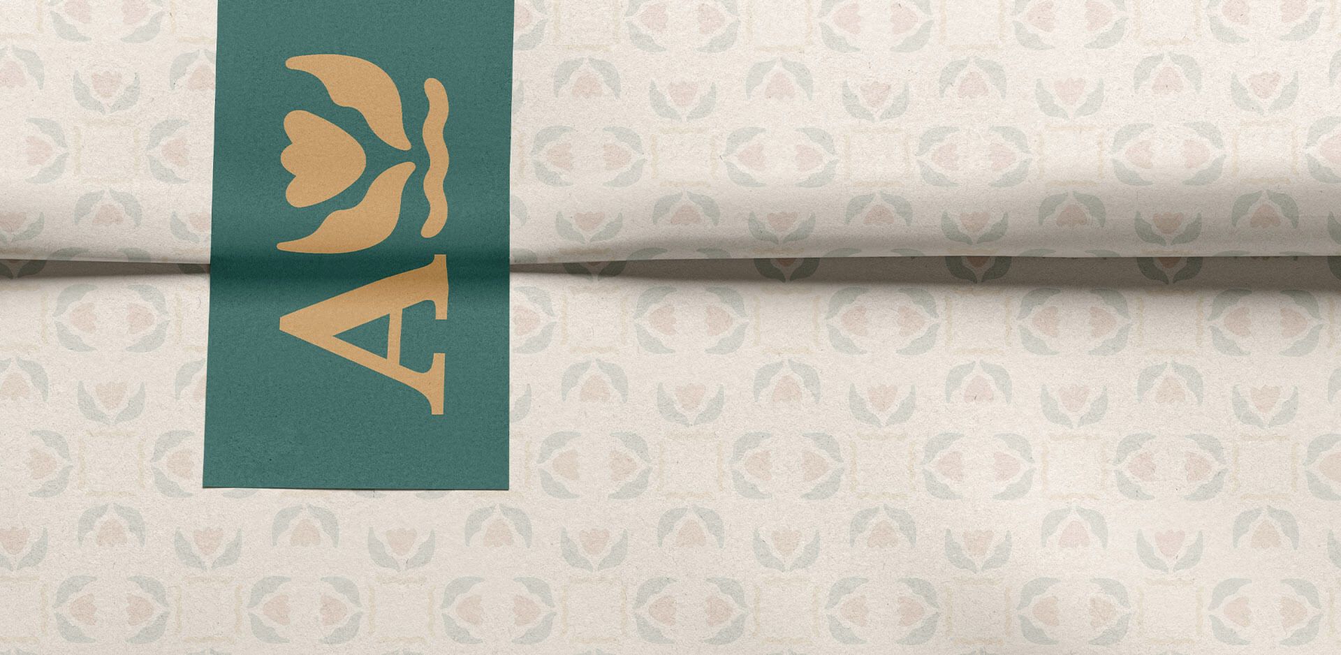 Tissue paper mockup with custom brand pattern. Rectangular sticker with an alternate mark from custom logo family.