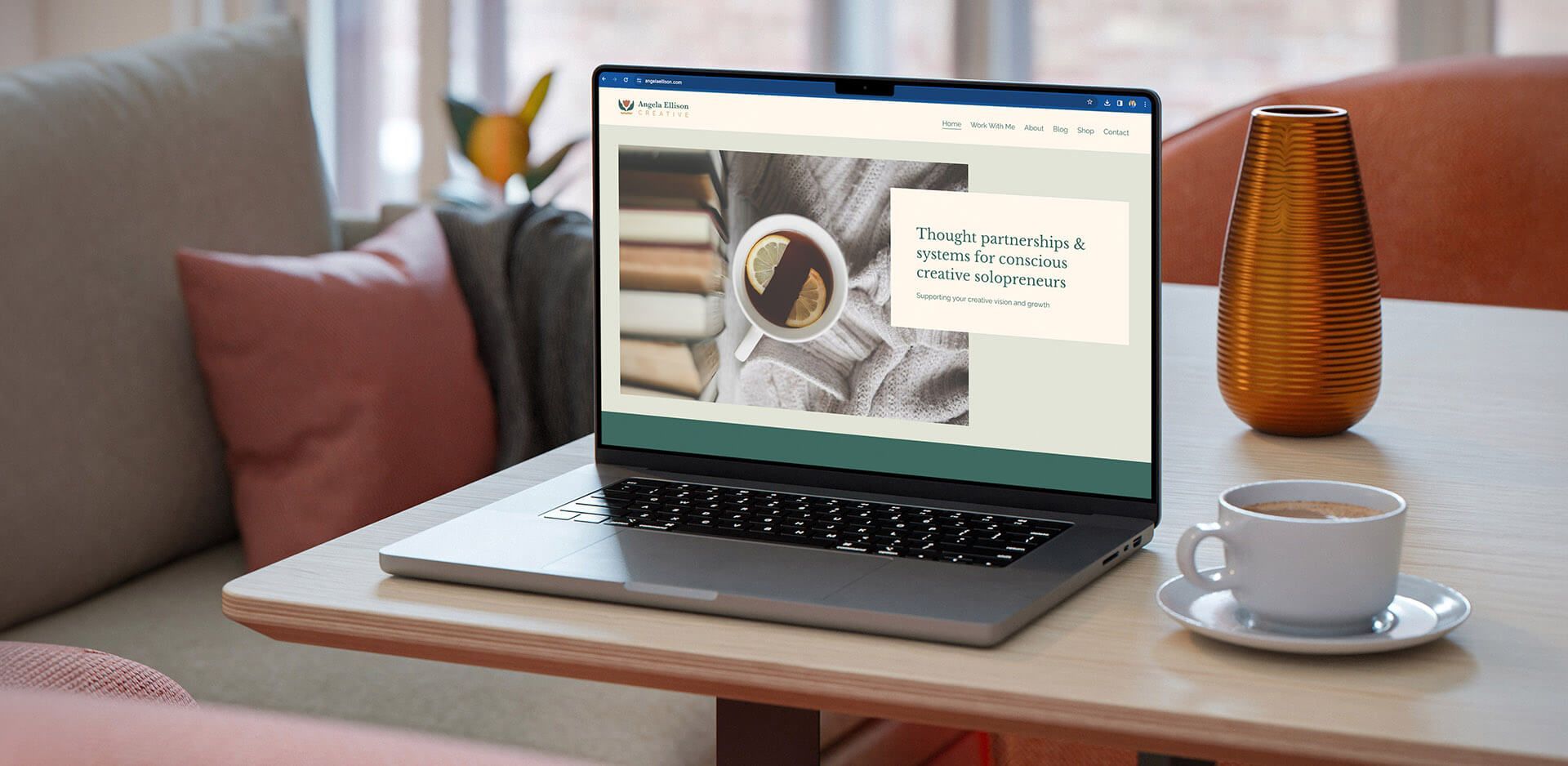 Purpose-driven business website on laptop sitting in cozy breakfast nook table.