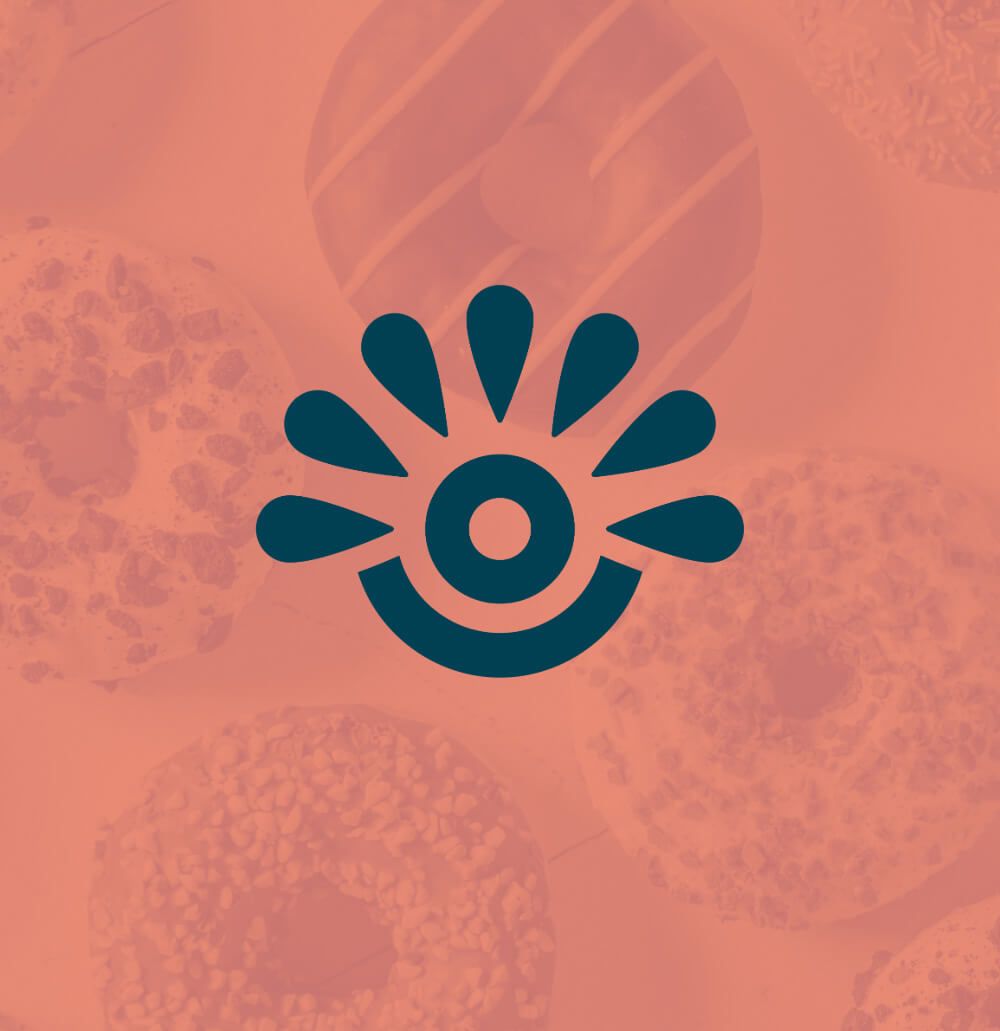 Logomark for food vendor displayed on top of a photo of donuts with a color overlay.