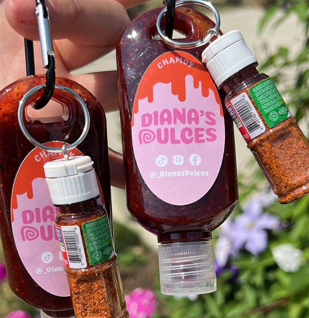 Travel sized chamoy with new custom sticker with tajin on a keychain.