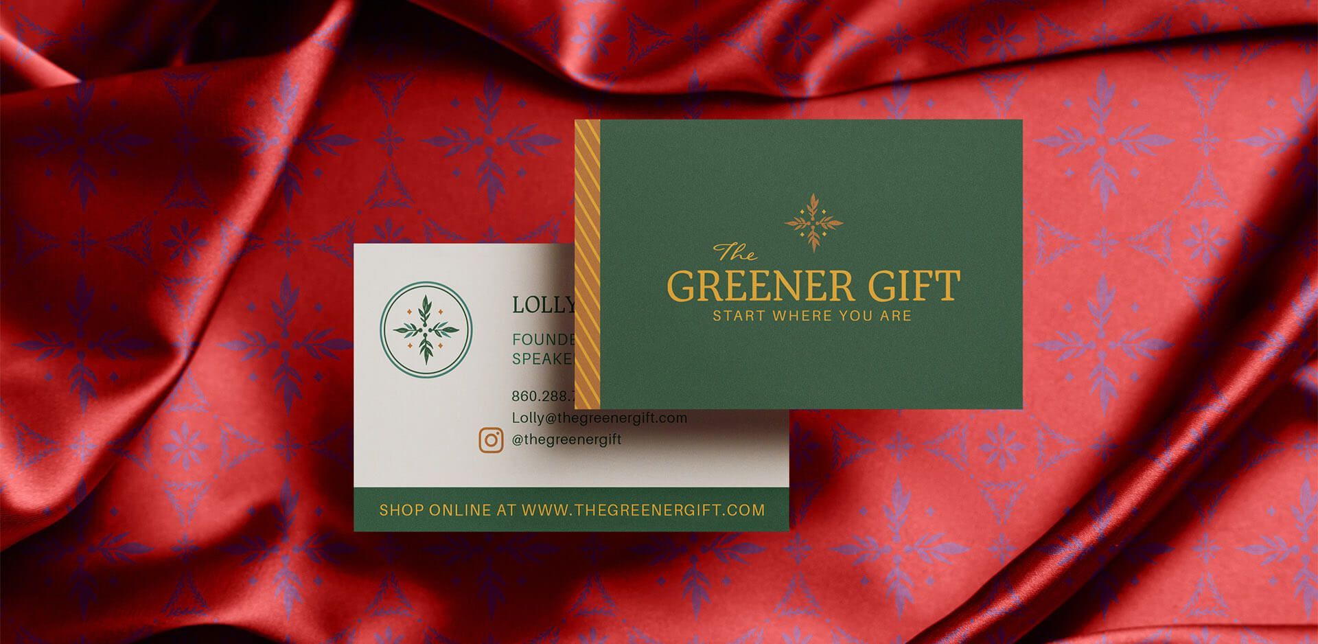 Business card front and back shown on top of a silky red patterned fabric. Created for sustainably-minded small business.