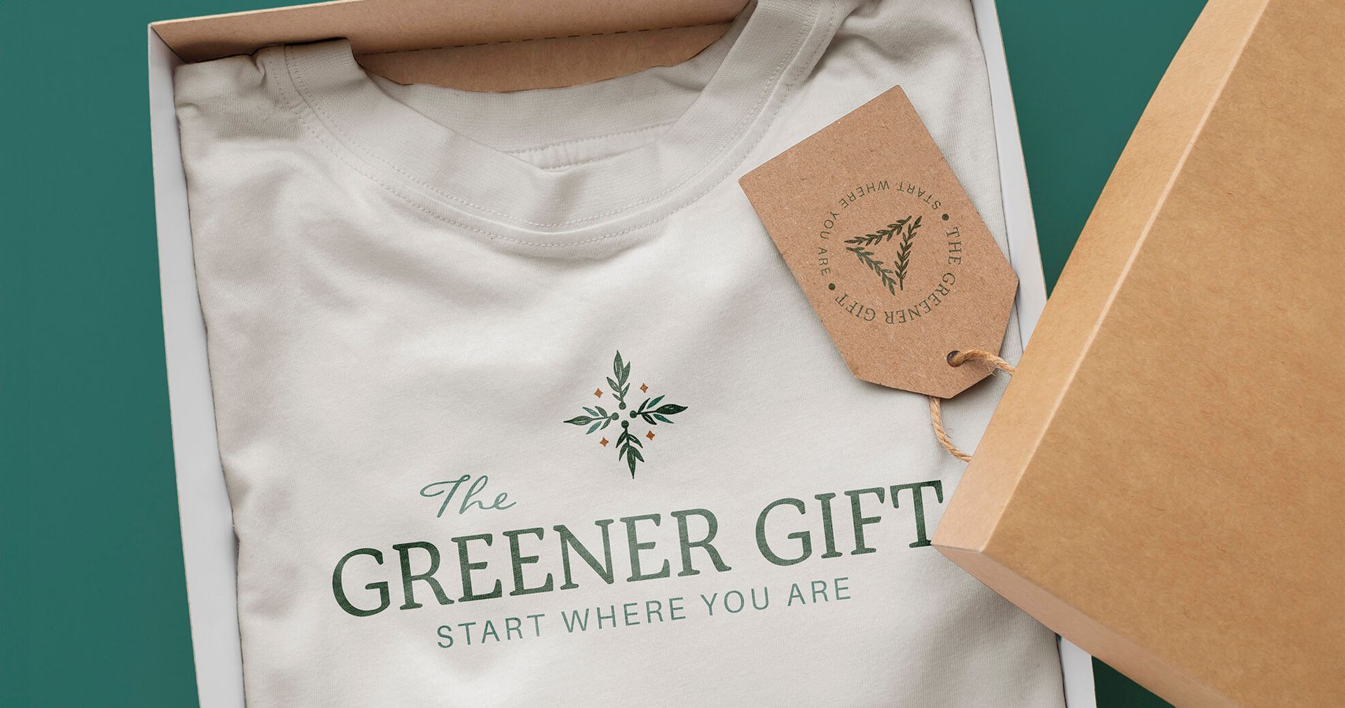 Apparel design mockup for sustainable business shown folded neatly in a cardboard box with a kraft paper tag.