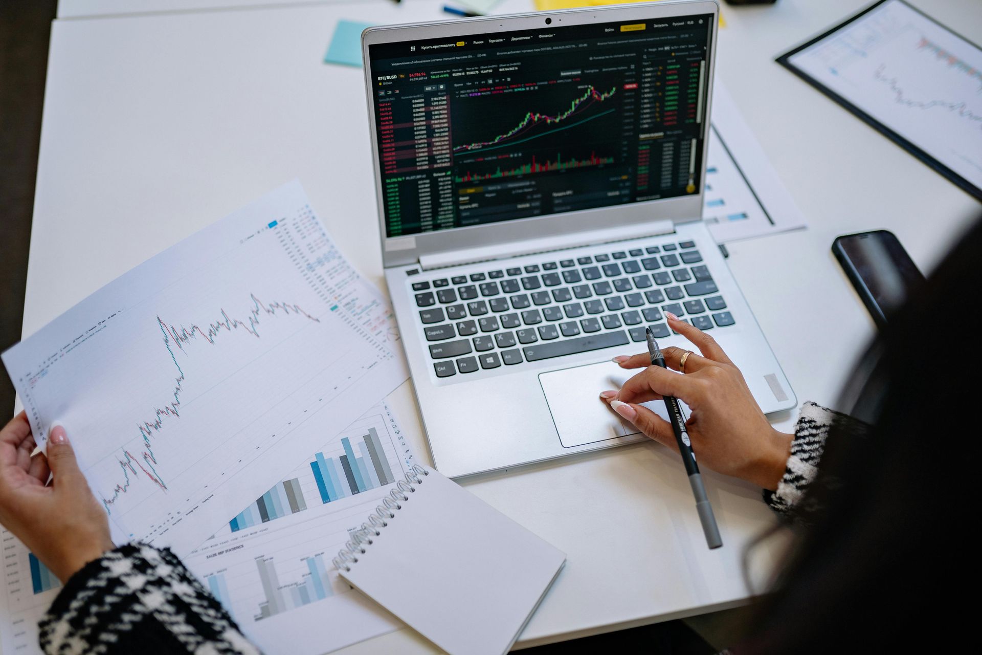 female entrepreneur doing research for her purpose-driven business at a laptop