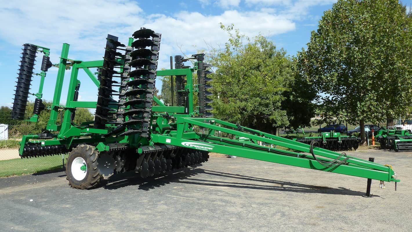 A Green and Black Tractor Is Parked on The Side of The Road — Cheshire Machinery in Murgon, QLD