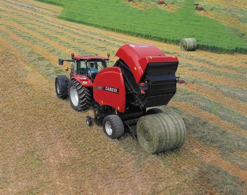 Round Bailer In A Field Rolling A Bail — Cheshire Machinery in Svensson Heights, QLD