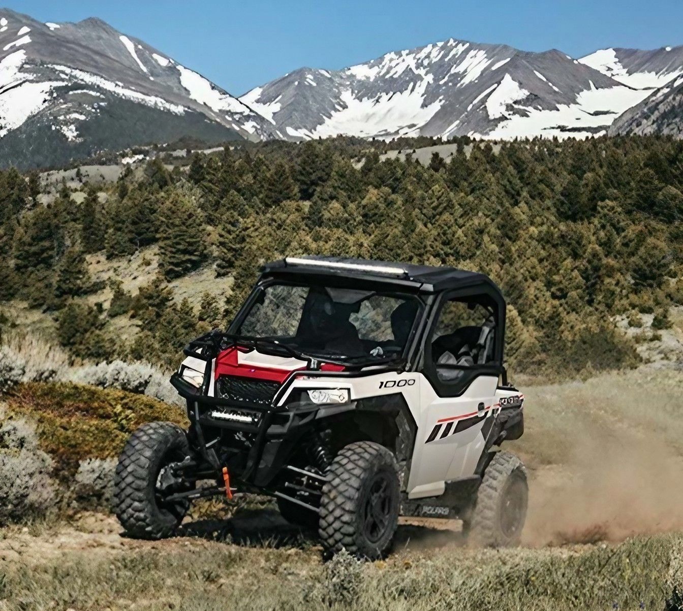 A Polaris Ranger 1000 Is Driving Through Dirt — Cheshire Machinery in Svensson Heights, QLD
