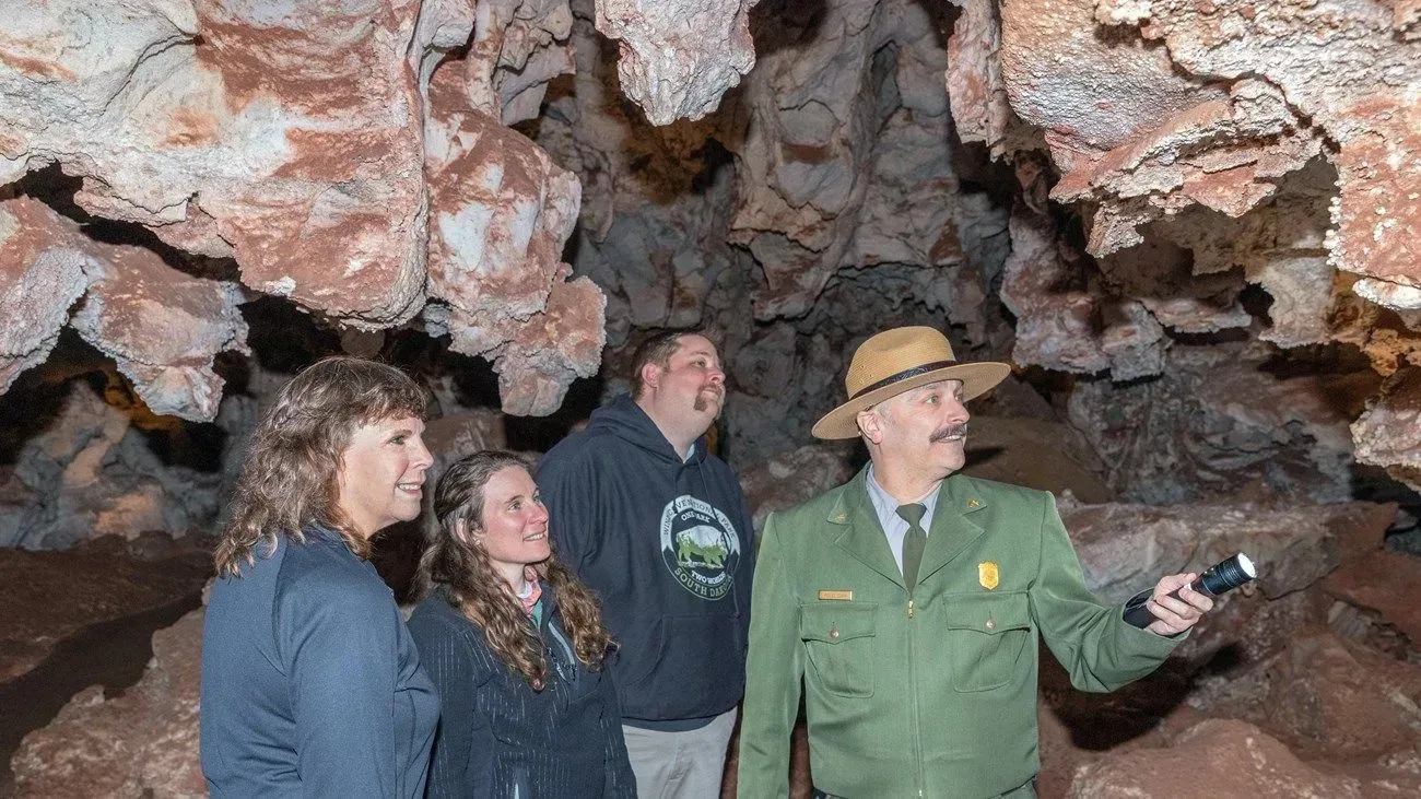 A large rock is sitting in the middle of a cave.