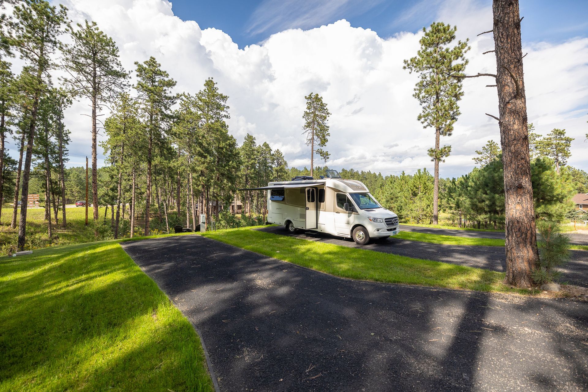 an rv is parked next to a concrete pad