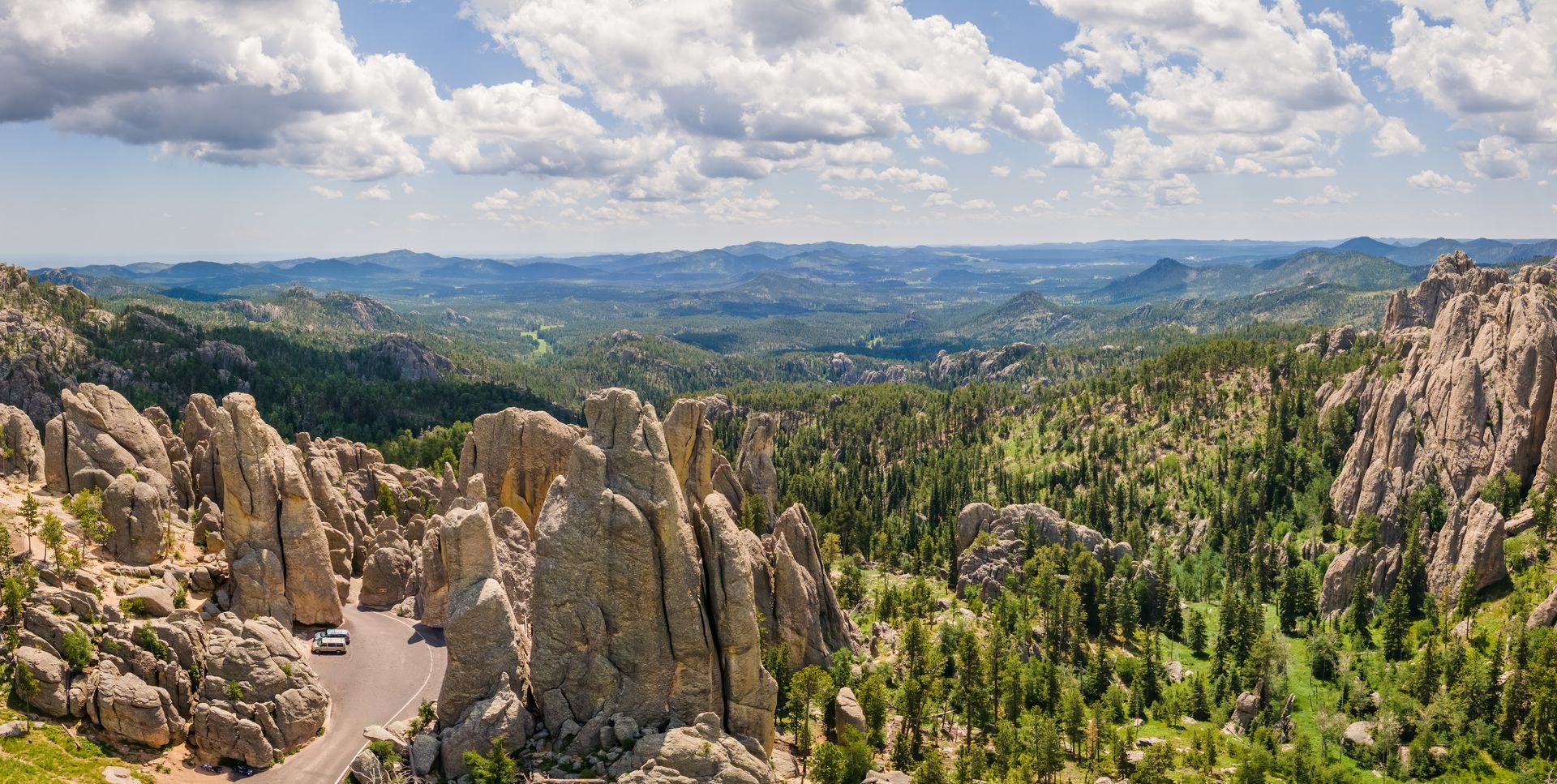 An aerial view of a mountain landscape with trees and rocks.