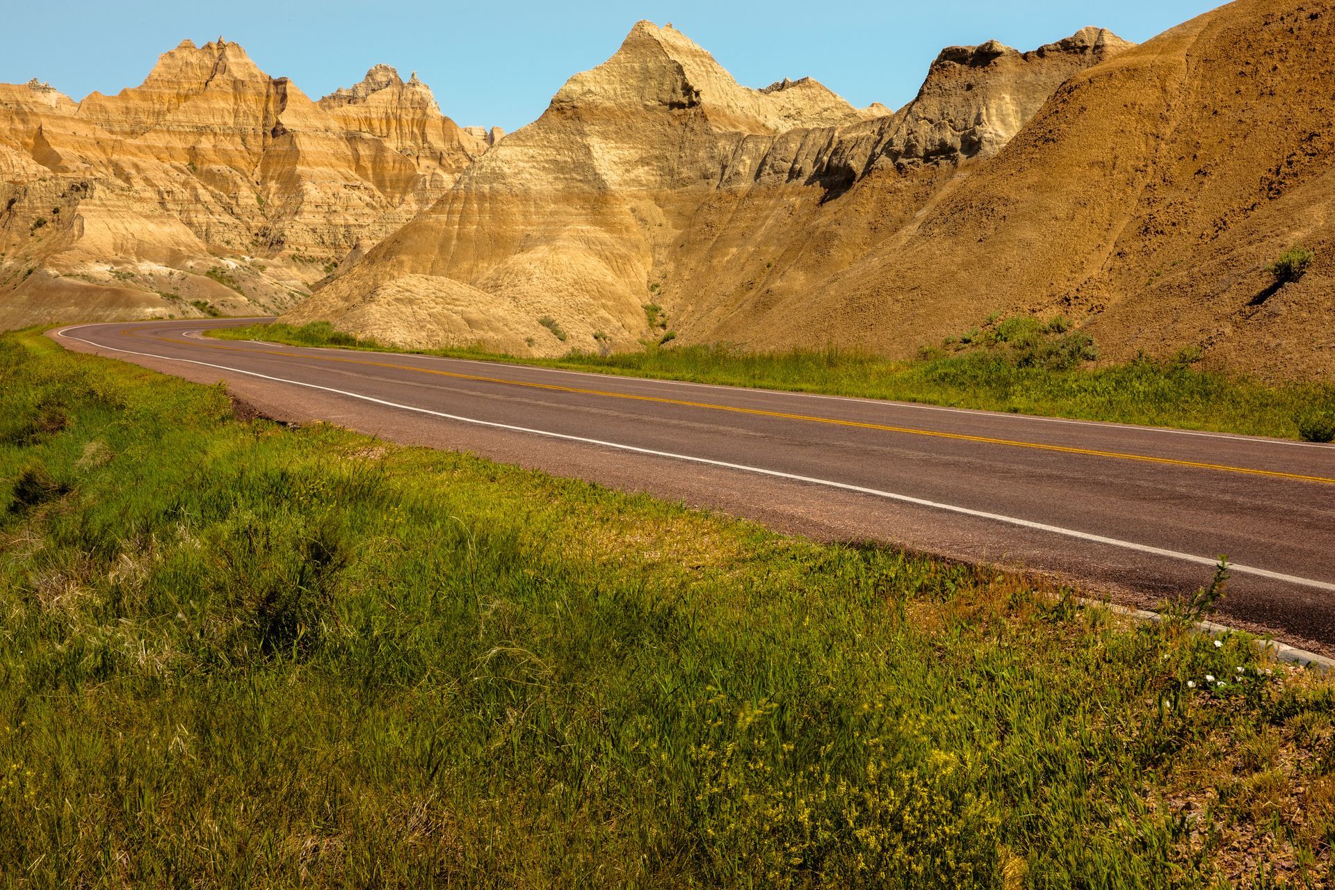 A road in the desert with mountains in the background