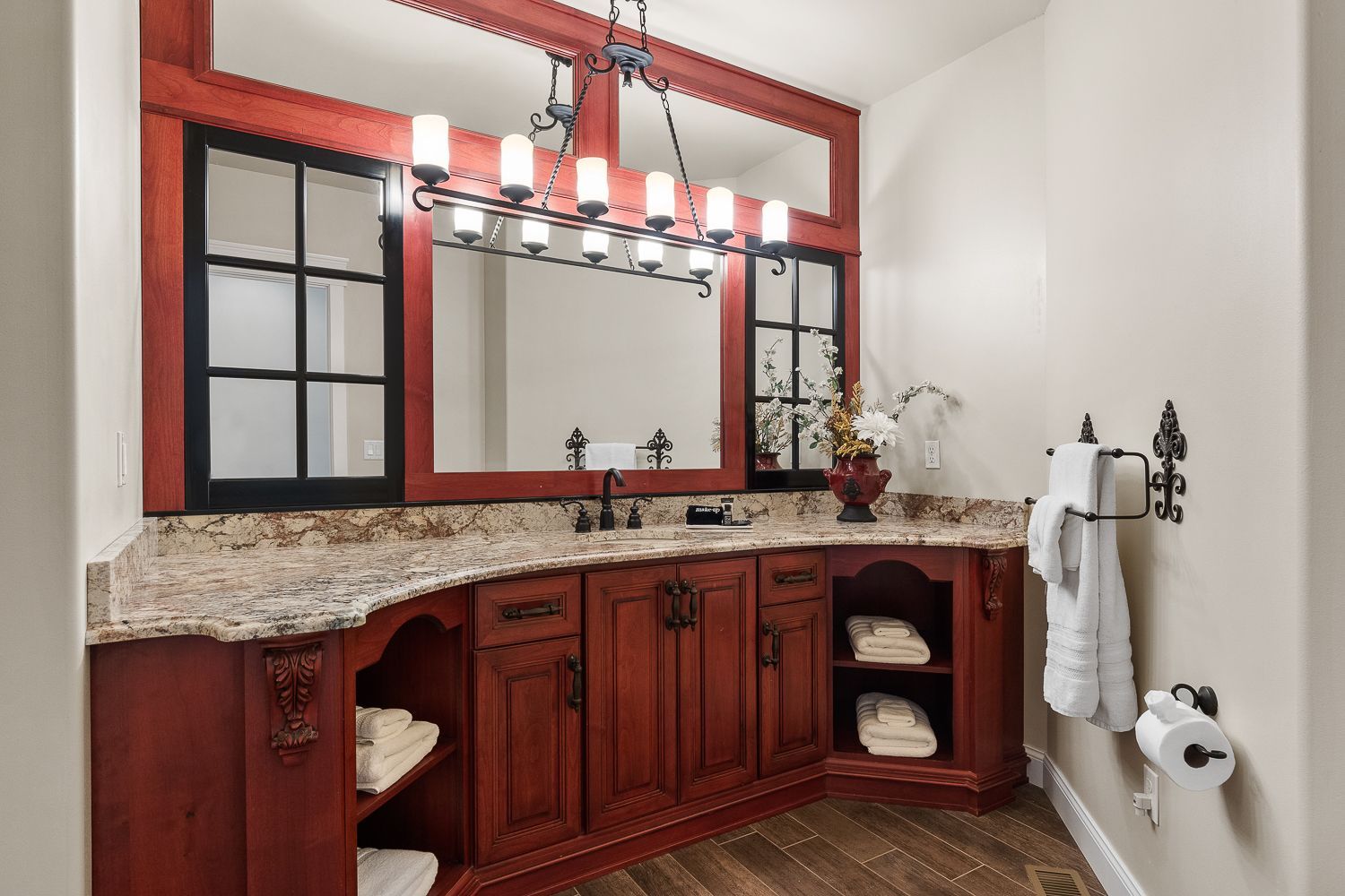 A bathroom with two sinks and a large mirror.