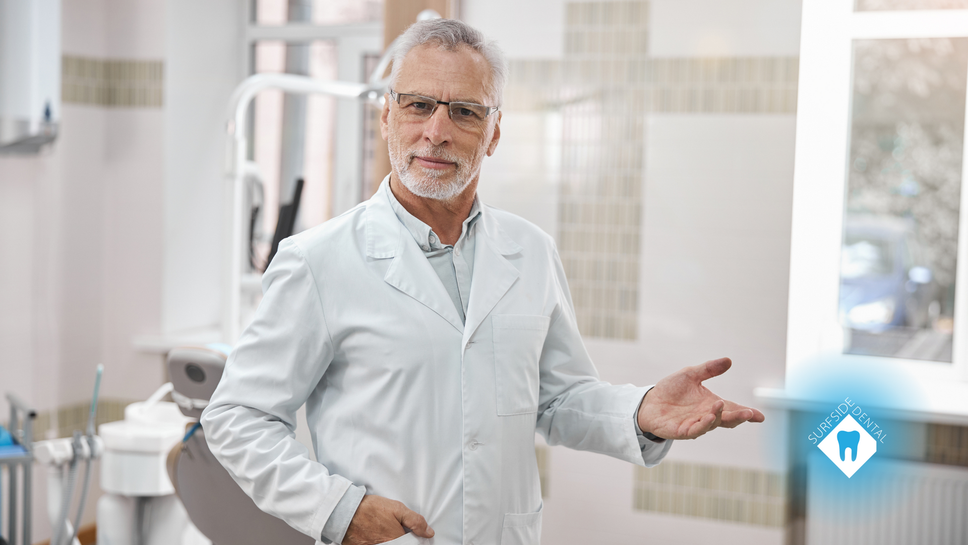 A dentist is standing in a dental office talking to a patient.