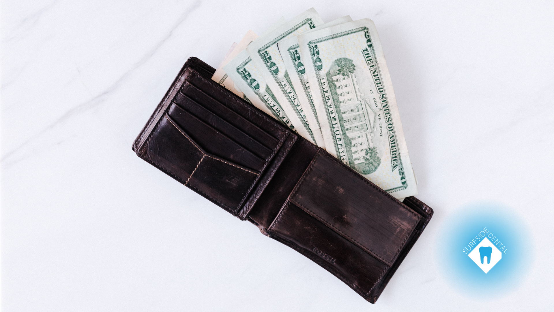 A wallet with a bunch of money in it