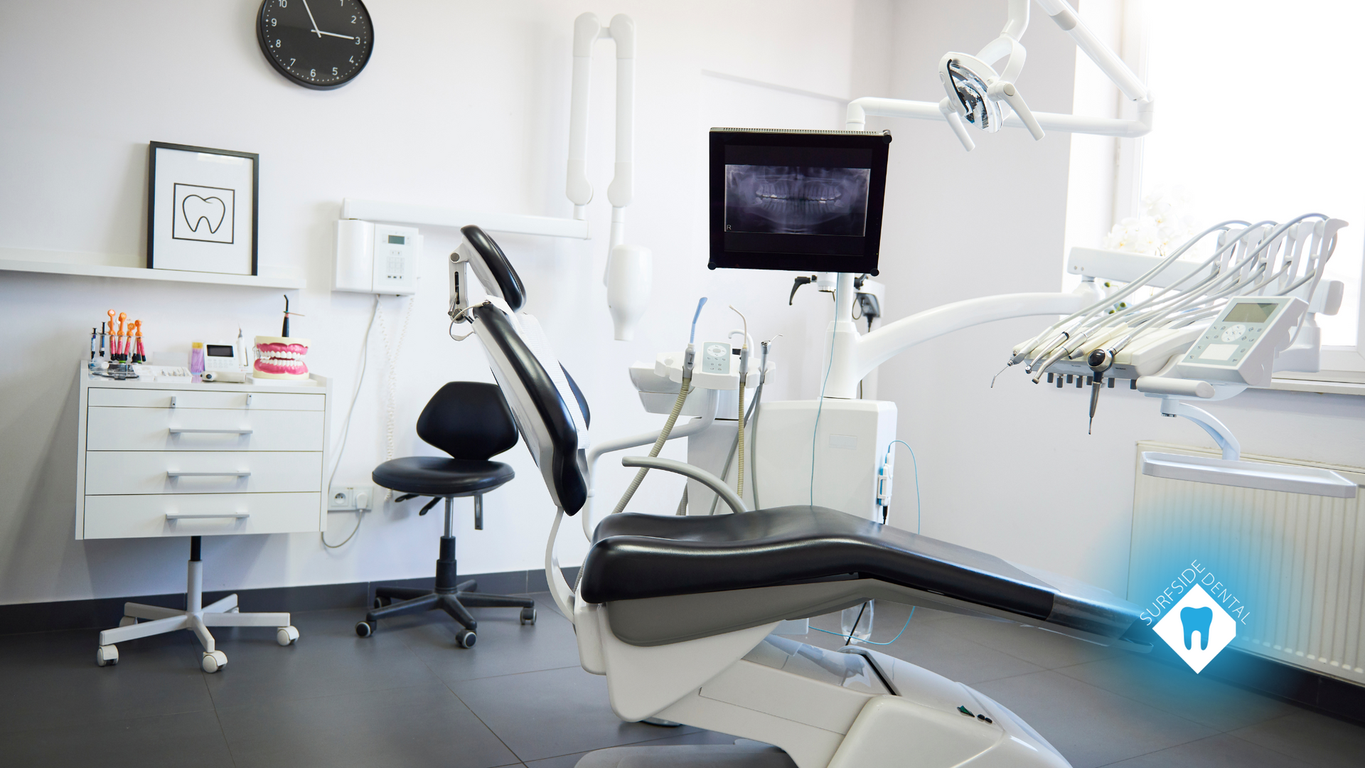 A dental office with a dental chair and a clock on the wall.