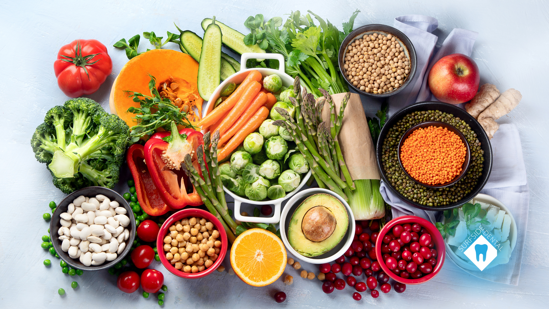 There are many different types of fruits and vegetables on the table.
