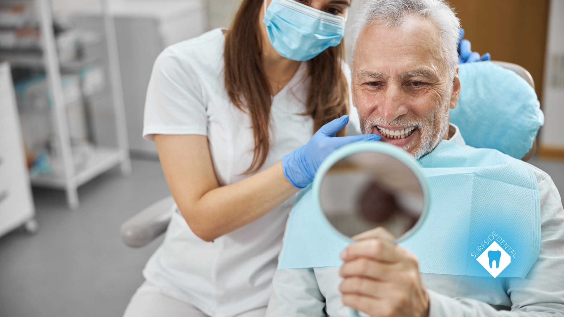 A dentist is looking at a patient 's teeth in a mirror.