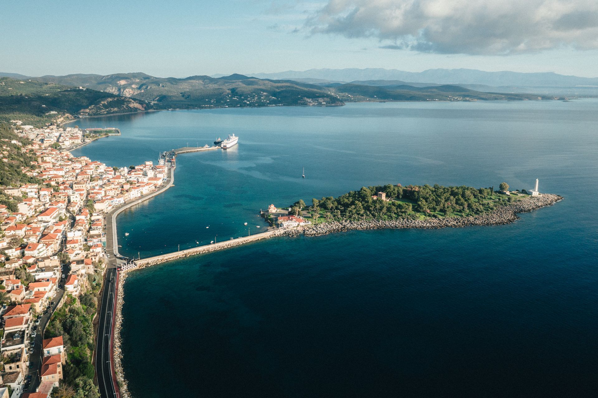 An aerial view of a small island in the middle of a large body of water.
