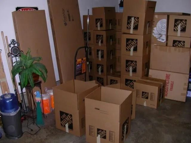 A bunch of home depot boxes stacked on top of each other