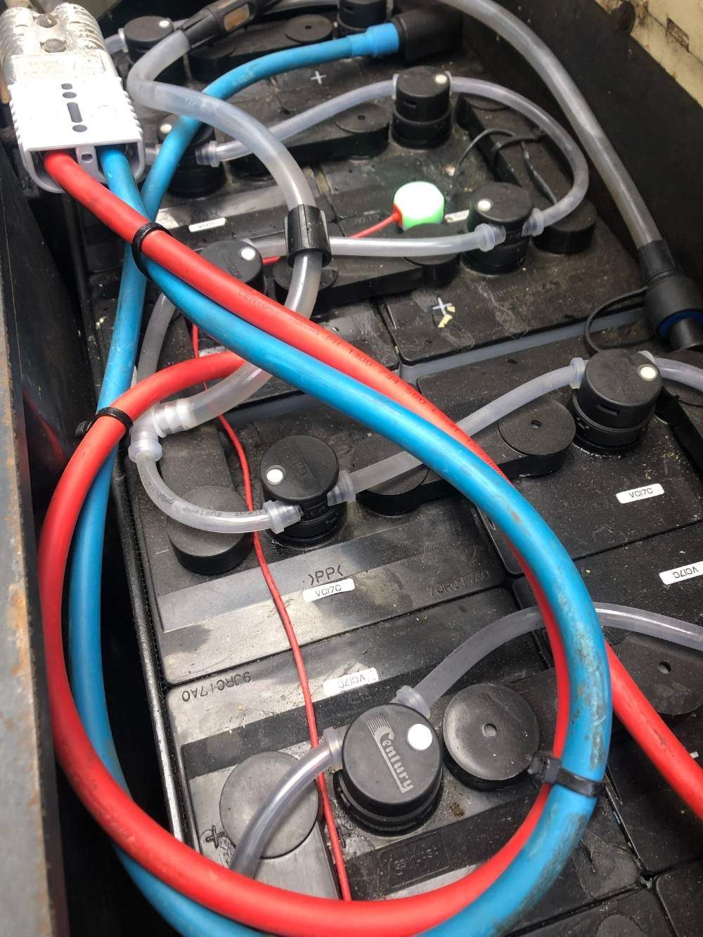 A Bunch of Wires Are Connected to A Battery — AAA Equipment Pty Ltd In Kempsey, NSW