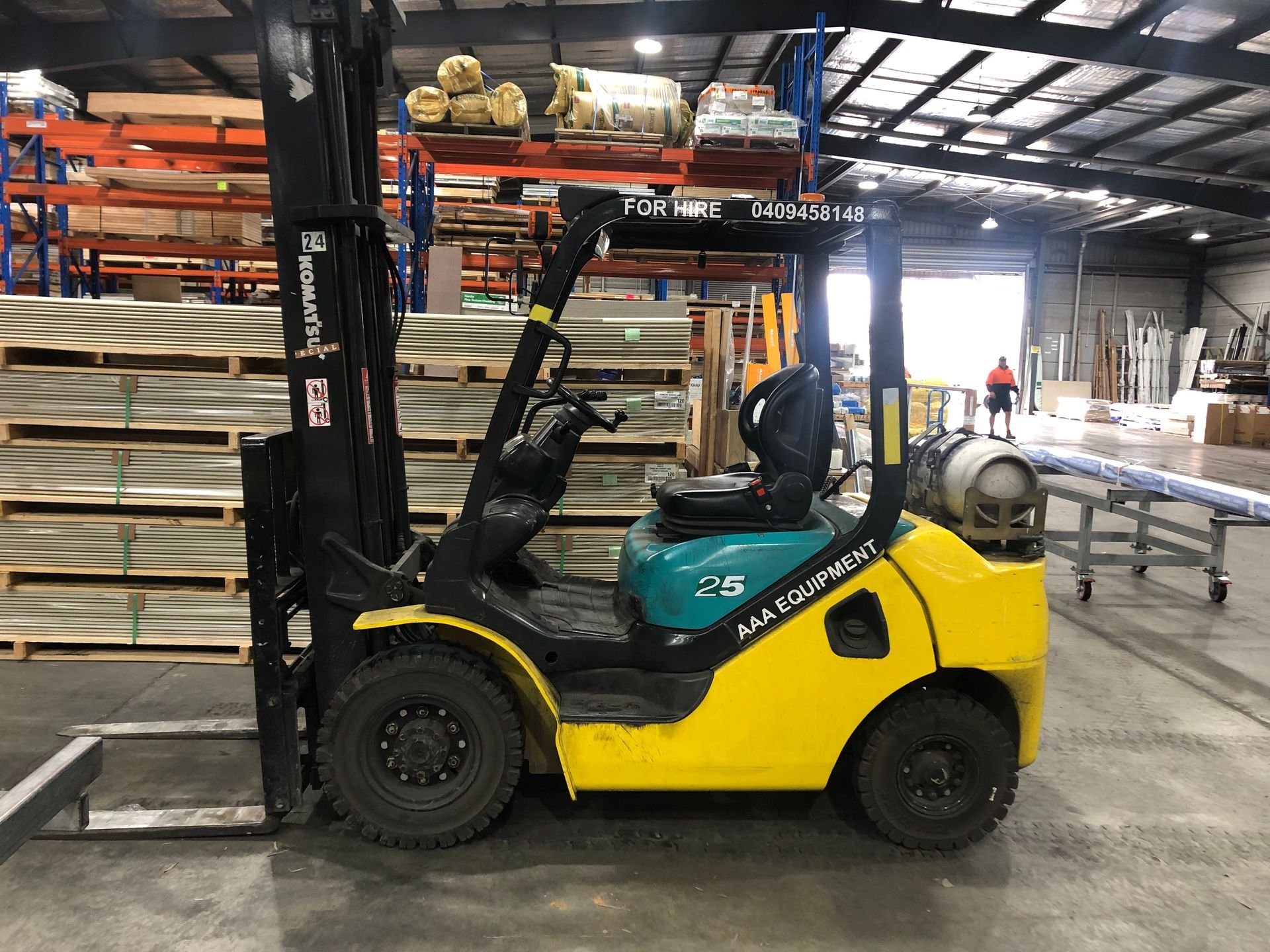 A Forklift Is Parked on The Side of some pallets— AAA Equipment Pty Ltd In Forster, NSW