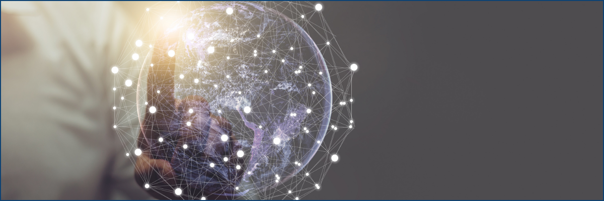 A person is holding a globe in their hand.