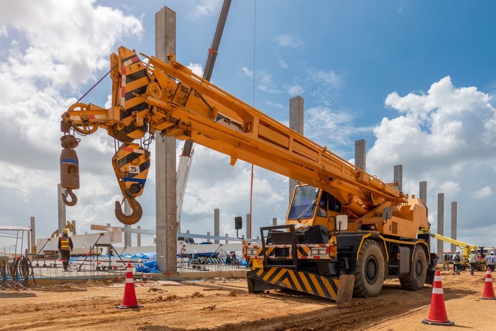 Large Yellow Crane is Sitting on Top of a Construction Site — Newcastle Cranes In Sydney, NSW