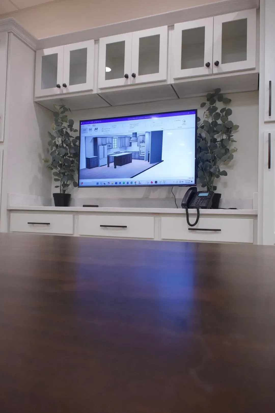 Built-in home office with floor-to-ceiling Fabu cabinetry and integrated wood-top desk