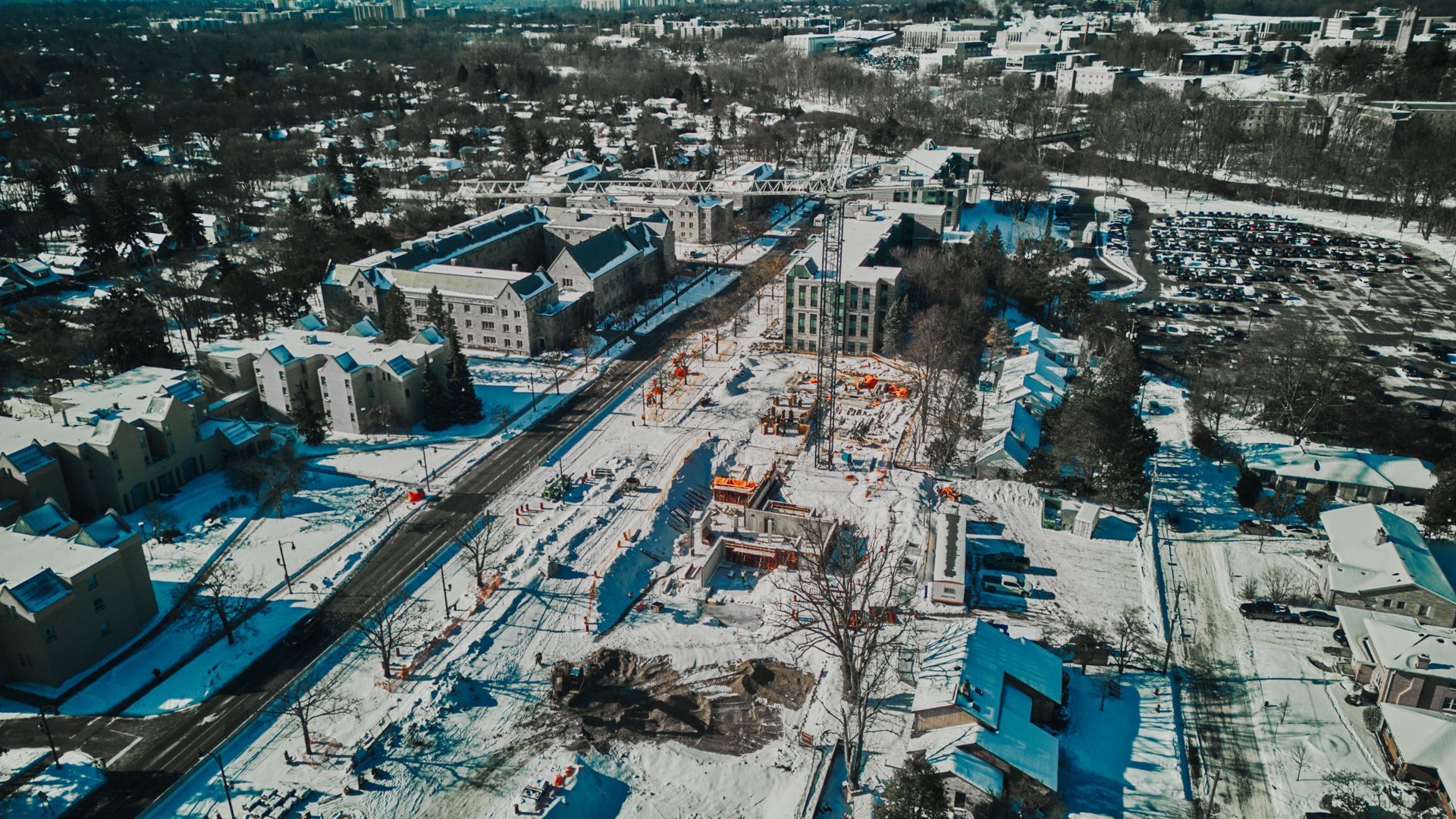 An aerial view of a city covered in snow.