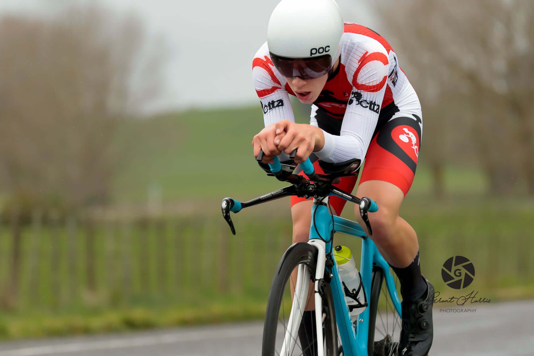 A person is riding a bike on a road.