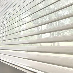 A close up of a window with white blinds on it.