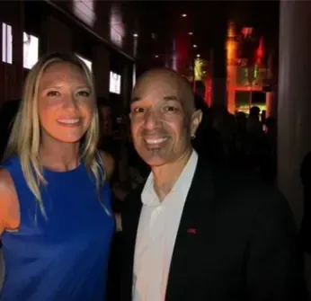 A man and a woman are posing for a picture together