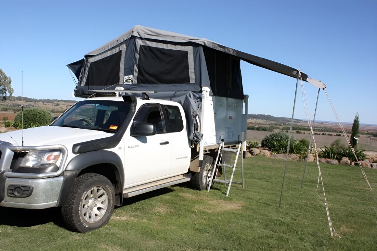 White Truck With a Tent on Top of It — Glenvale Canvas Pty Ltd in Wilsonton, QLD