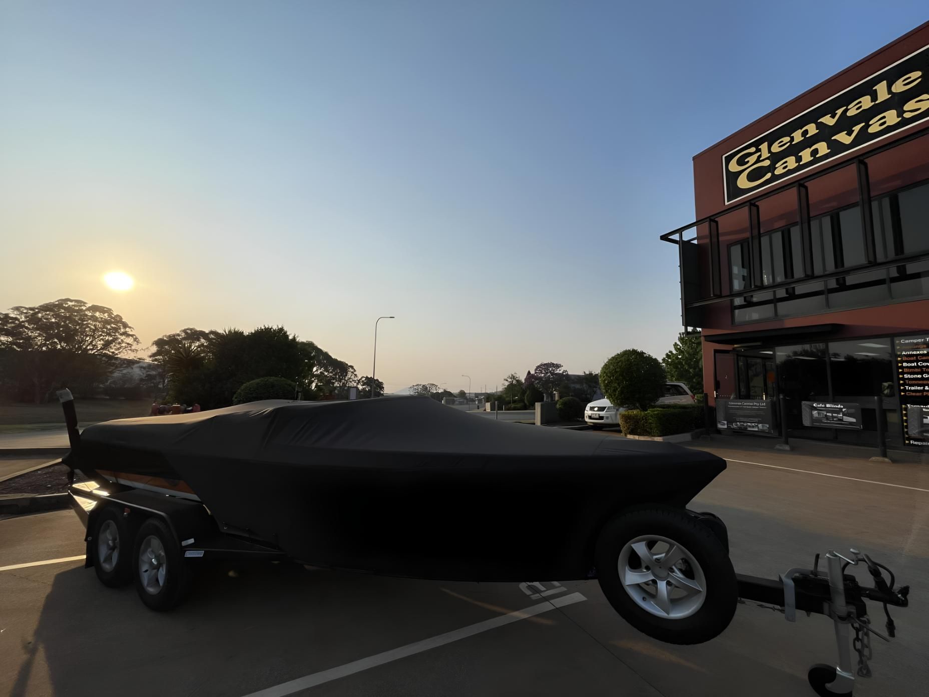 Covered Boat in Front of Building — Glenvale Canvas Pty Ltd in Wilsonton, QLD