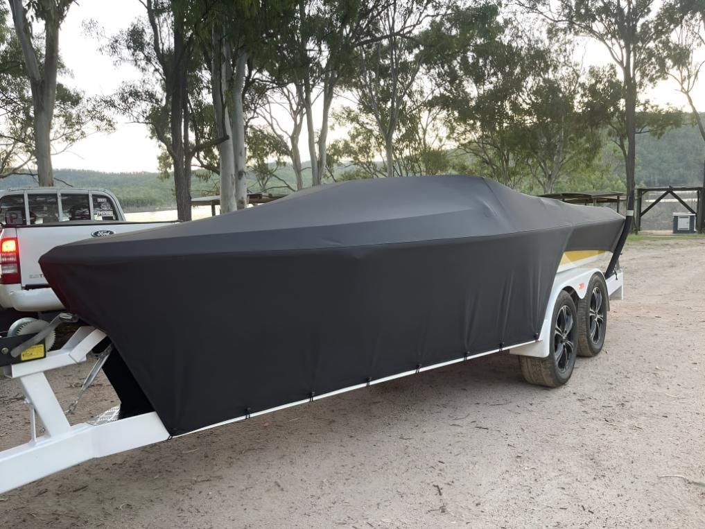 Boat is Covered in a Black Cover — Glenvale Canvas Pty Ltd in Wilsonton, QLD