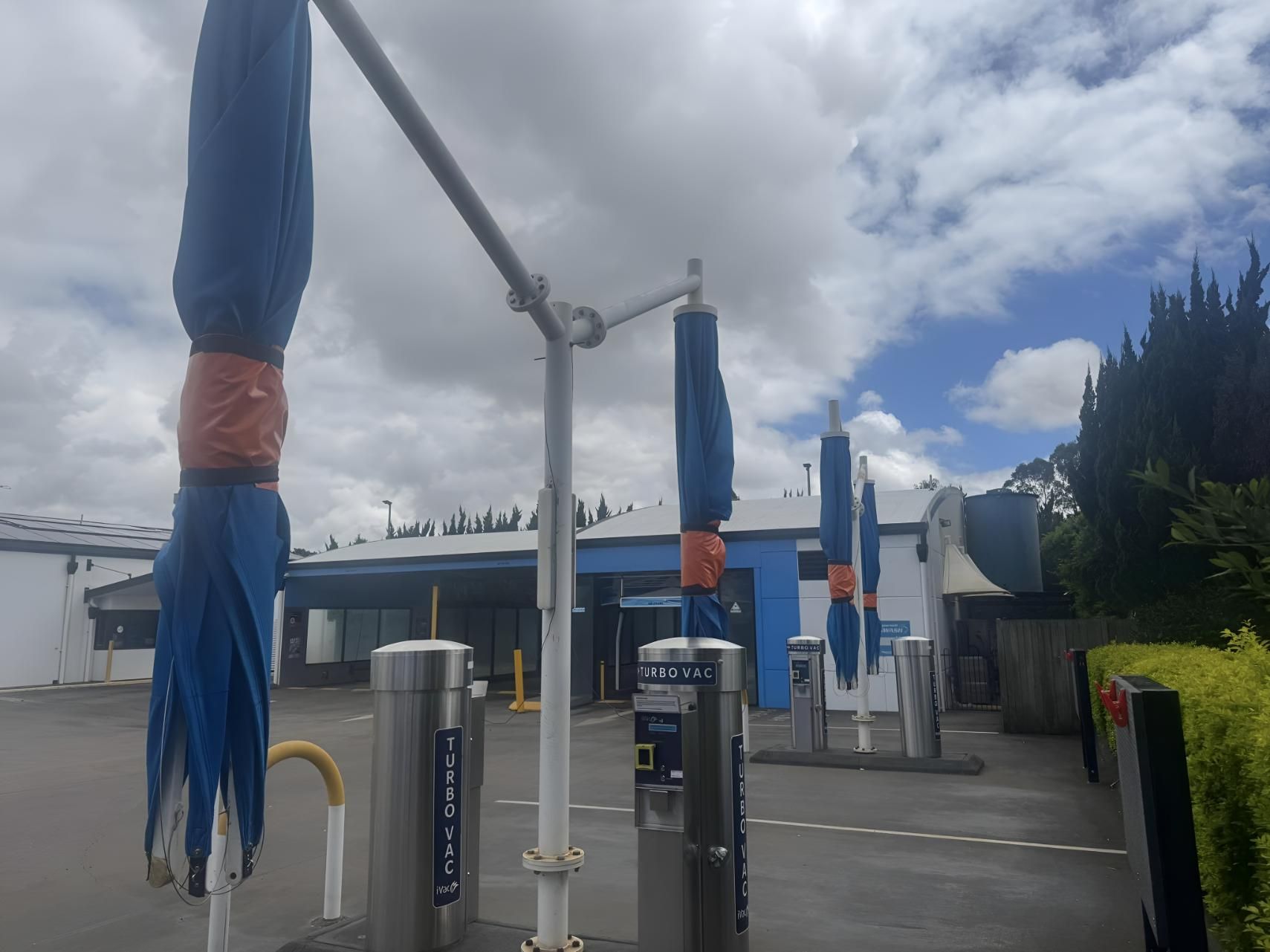 Car Wash With a Lot of Umbrellas in Front of It — Glenvale Canvas Pty Ltd in Wilsonton, QLD