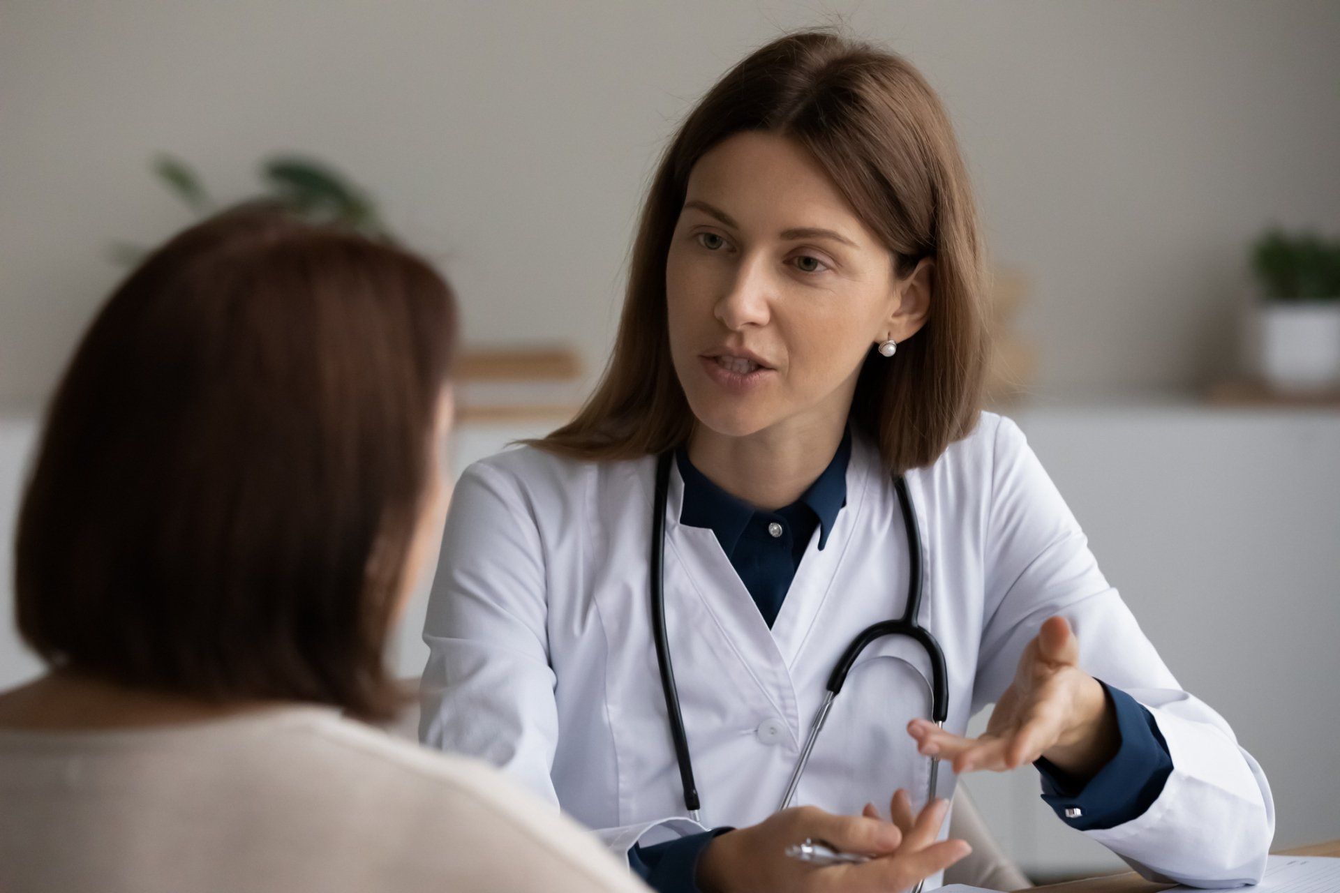 Nurse With Senior Lady Sitting — Ramsey, MN — Midwest Paramedical