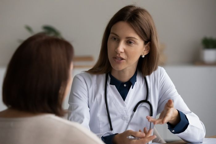 Nurse With Senior Lady Sitting — Ramsey, MN — Midwest Paramedical