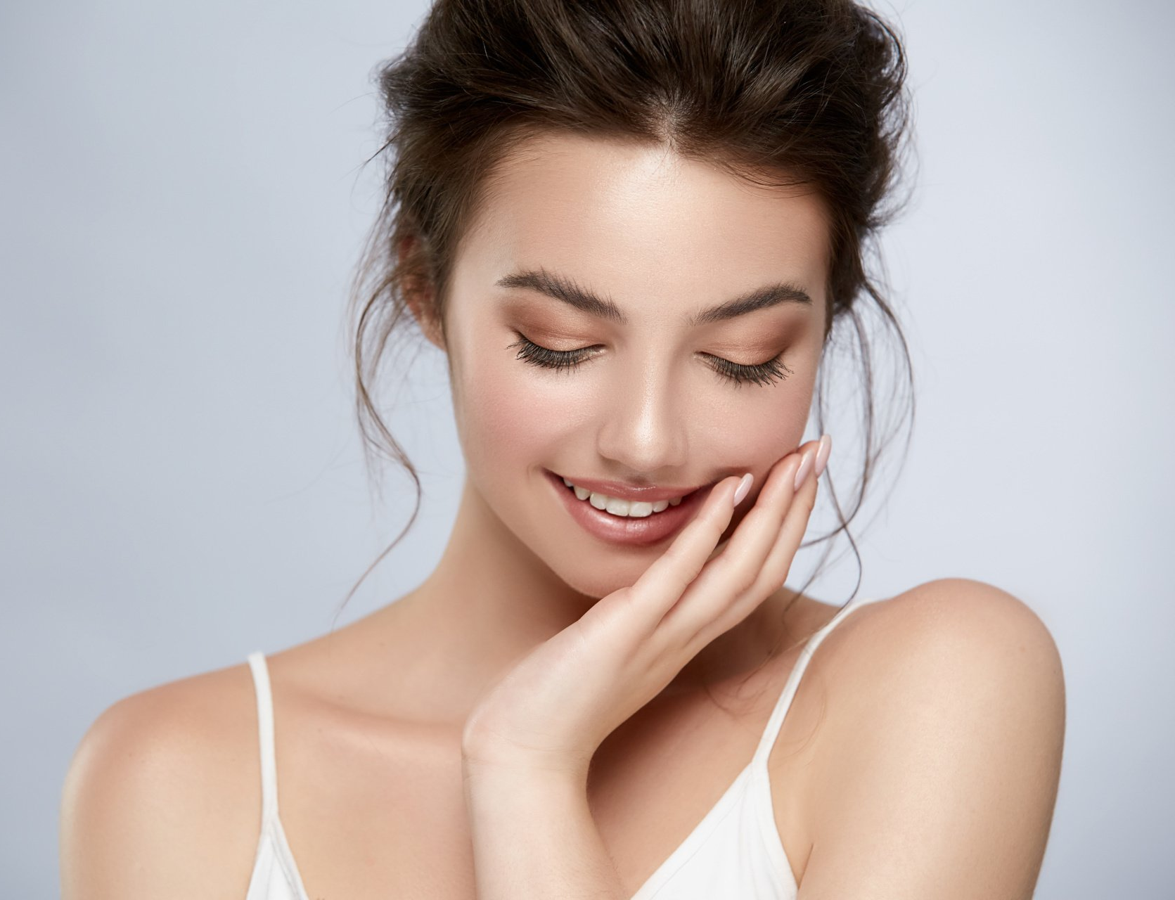 model with beautiful skin after cosmetic treatment at Pure Dermatology