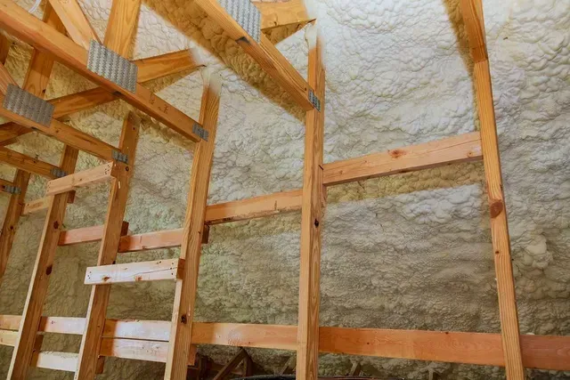 Fresh spray foam insulation installed between wall framing by Foam Insulation Solution in Yakima WA