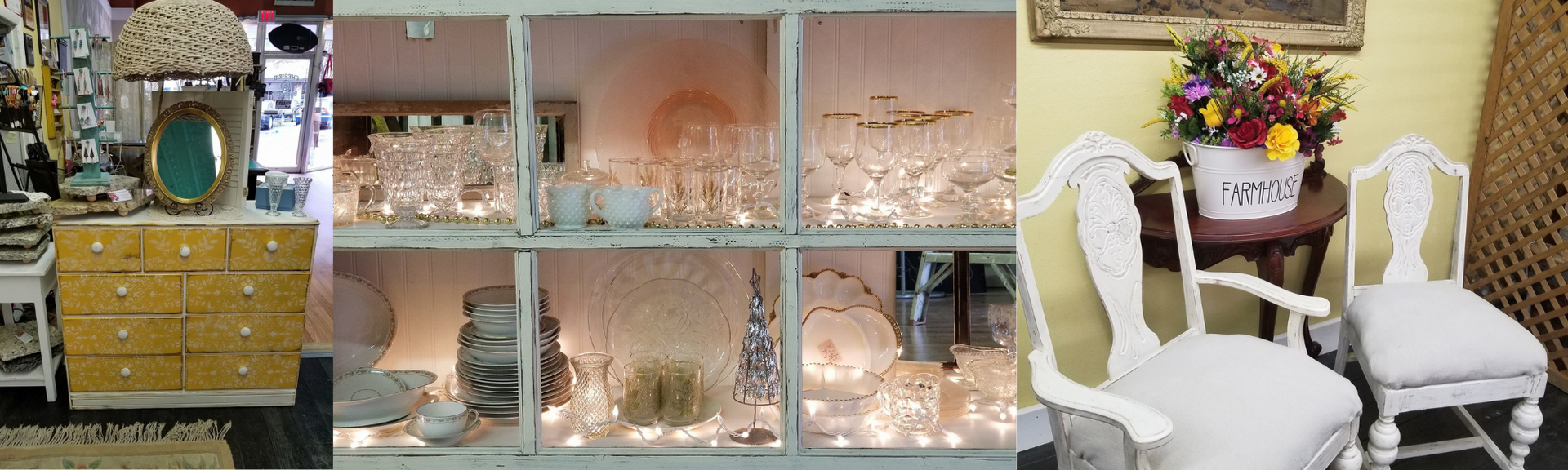 Decorated living room with lit glass cabinets, a dresser, and two white chairs by a small table and flowers